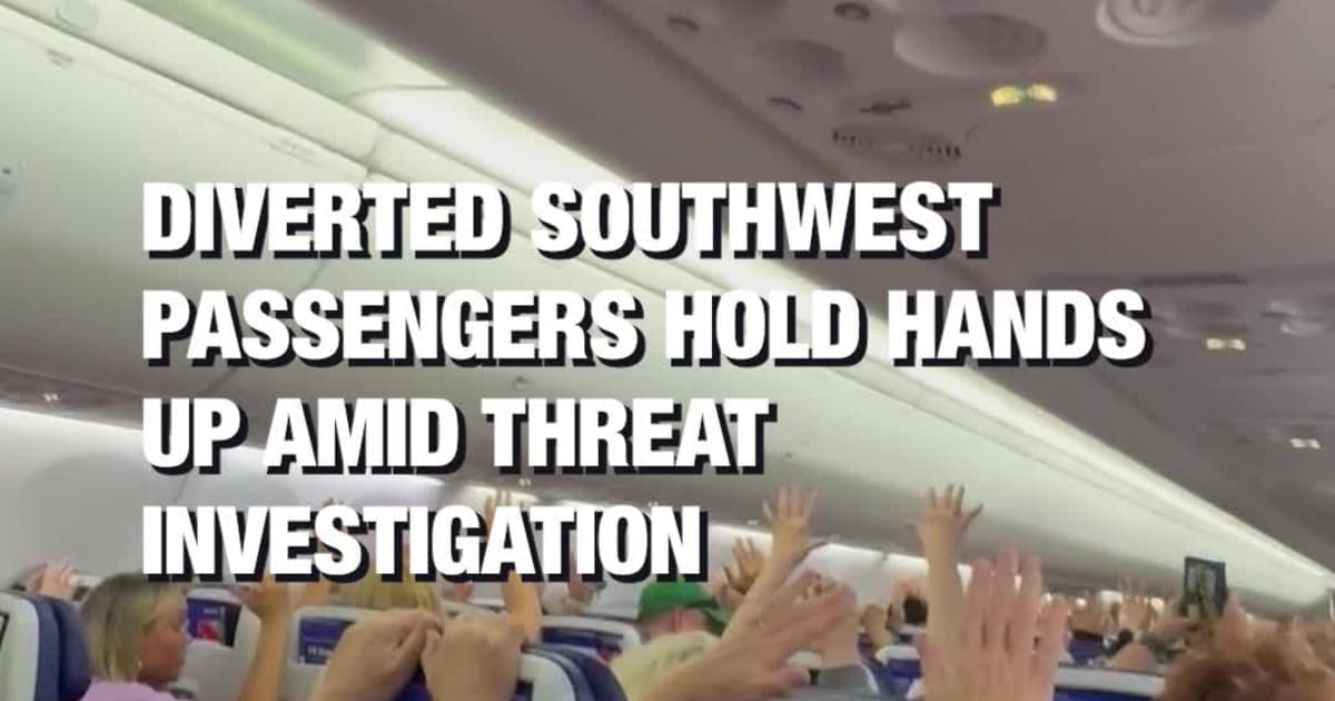 Diverted Southwest Passengers Hold Hands Up Amid Threat Investigation