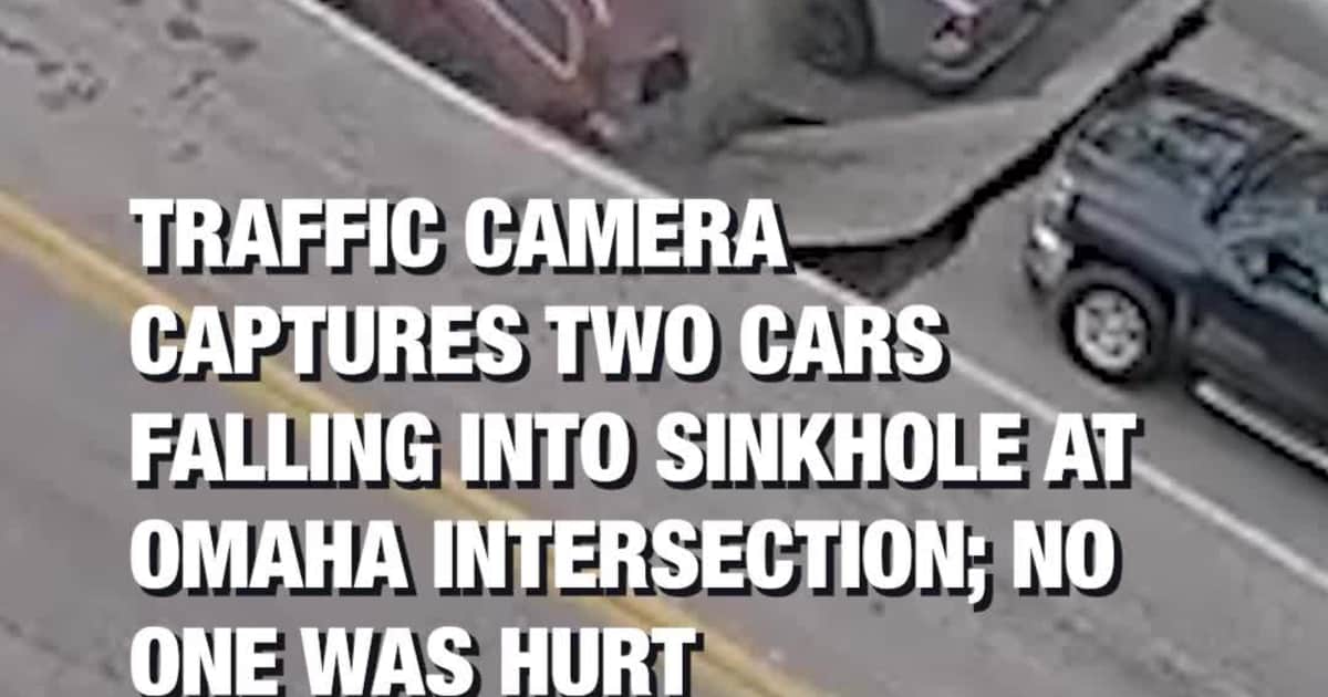Traffic Camera Captures Two Cars Falling Into Sinkhole at Omaha Intersection; No One Was Hurt
