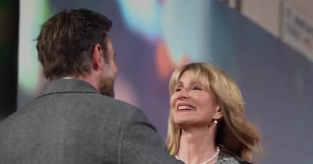 Bradley Cooper and Laura Dern share a hug that stole the spotlight before the screening even began