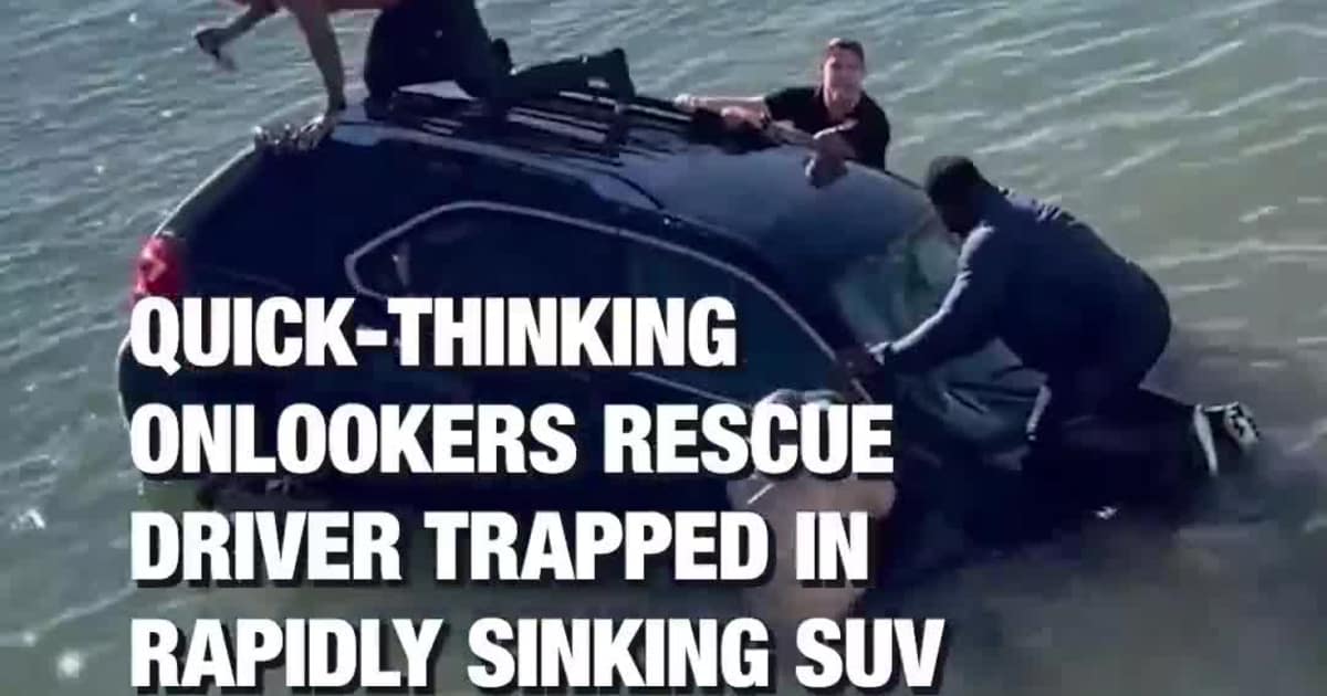 Community members worked together to rescue a driver trapped inside a sinking SUV in Virginia Beach, Virginia, on Friday, January 16.