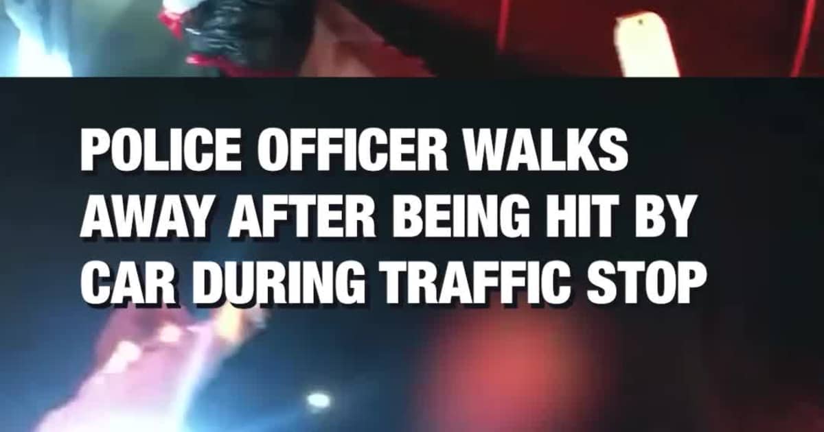Police Officer Walks Away After Being Hit by Car During Traffic Stop