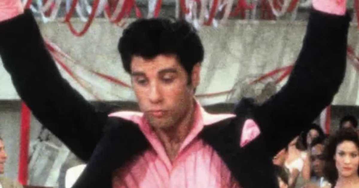 John Travolta Channels Danny Zuko as Santa in New Holiday Ad